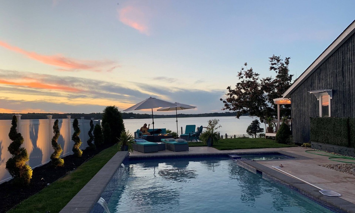 Elkton House | Breathtaking waterfront property with pool, private dock and open floor plan.