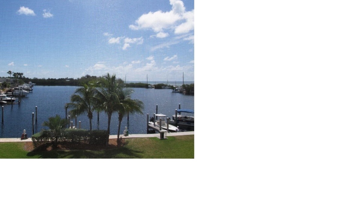 Islamorada Condo | Luxury 3 bedroom condo overlooking harbor with ocean view, boat slip, amenities