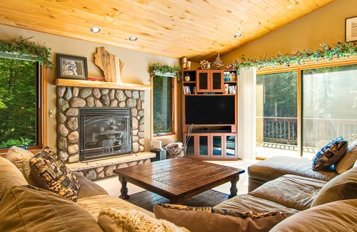 Sayner House | All-seasons home with walking trails, sledding hill, firepit, fireplaces & deck