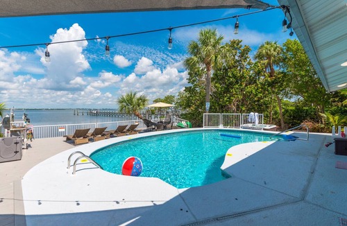 Stuart House | Aquatopia North: Riverfront beach house, w/dock, heated pool + hot tub & more!