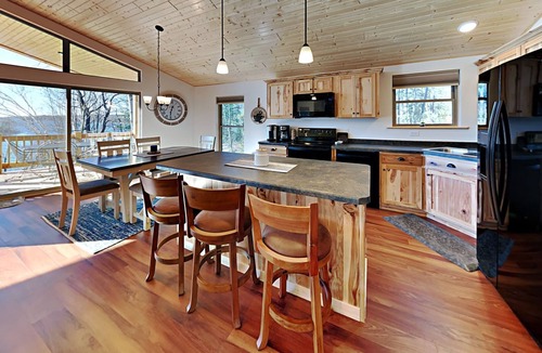 Chief Lake Cabin | Brand New 5 bedroom Lacourte Orellies lakefront home with covered deck and amazing lake views.