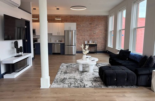 Central Business District Apartment | Bright Sunlit Studio in Downtown Rochester Floor-to-Ceiling Windows
