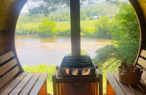 Johnson House | Caboose Tiny Home on river with hot tub near Stowe