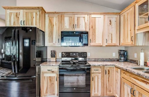 Conover House | Charming dog-friendly cabin with hot tub, fireplace, patio, grill, & central AC