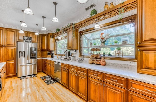 Boring House | Countryside home with private swim spa, fire pit, spacious kitchen, & game room