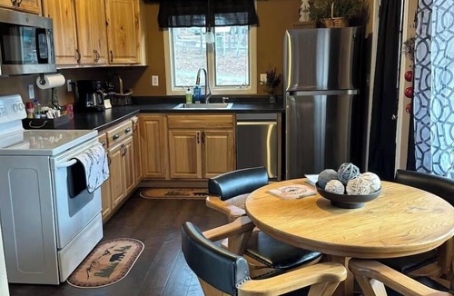 Stambaugh House | Cozy chalet located in Ski Brule Village features 4 bedrooms and 2 living areas.