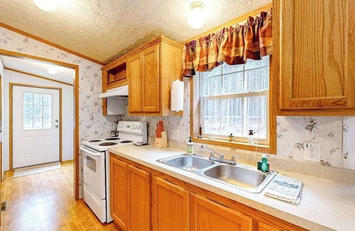 Conover House | Cozy, dog-friendly home with on-site snowmobile/ATV trails & firepit
