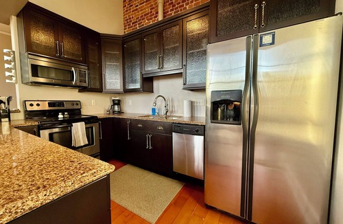 Cedar Falls Apartment | Downtown CF Retreat: King Beds, Brewery Below!