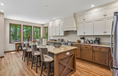 Waterfront Greens House | Experience luxury at 'Somewhere Only We Know' in Stillwater with stunning lake views!