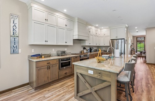 Waterfront Greens House | Experience luxury at 'Somewhere Only We Know' in Stillwater with stunning lake views!