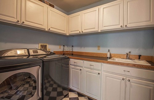 Black Butte Ranch House | GH219 | Luxury home with a private hot tub and large deck and grassy yard.