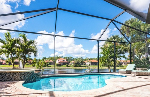 Naples Heritage Villa | Grand 4/3 pool home with beautiful lake sunset views minutes from the beach!