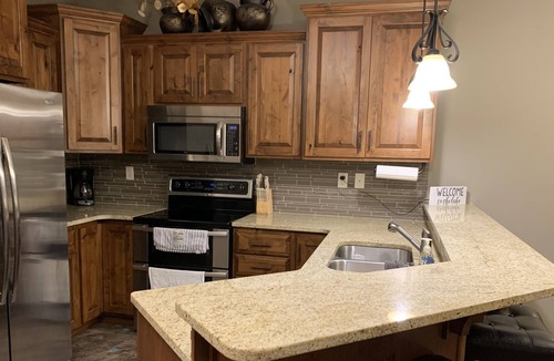 Spirit Lake Condo | Ground Floor Lakefront Unit with Stunning Views of East Lake