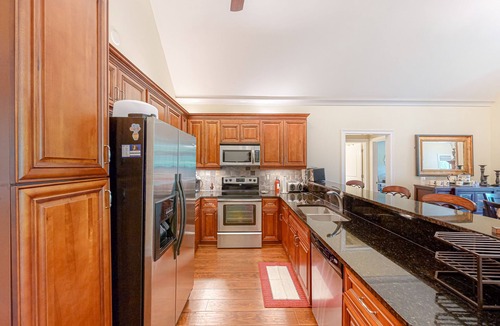 Sparta House | Inviting waterfront home with fireplace, dock, patio, central AC, & W/D