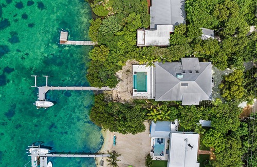 Tavernier House | Islamorada Bayfront home, sunsets, remodeled, infinity pool, beach, dockage.