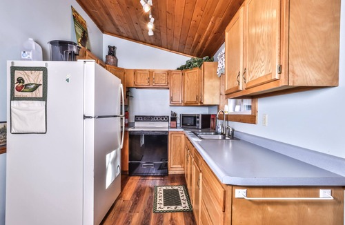 St Germain Cabin | Lakeside resort cabin right on Little Saint with dock, sandy beach, firepit!