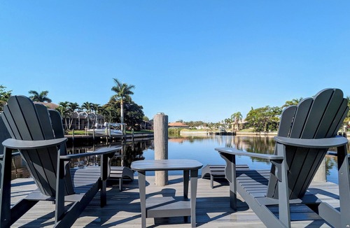 Cape Coral House | Luxury south facing waterfront home with heated salt pool and spa!