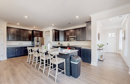 Seaford House | Newly built riverfront home with dock, kayaks, basketball court, & game room