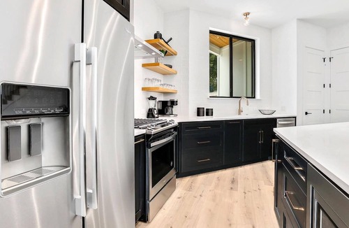 Elmhurst Heights House | Pool + Mural Patio | South Austin Retreat