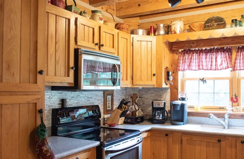 Luray Cabin | Rustic Log Lodge Overlooking Water and Mountain Views