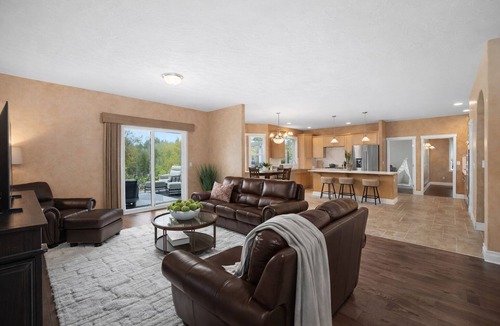 Olympia House | Sleeps 16 on 1.3 private acres near Boston Harbor. Spacious 6BR home with hot tub, game room, exercise equipment & large gathering spaces. Ideal for groups & families seeking privacy, comfort & fun with room to spread out and enjoy time together.