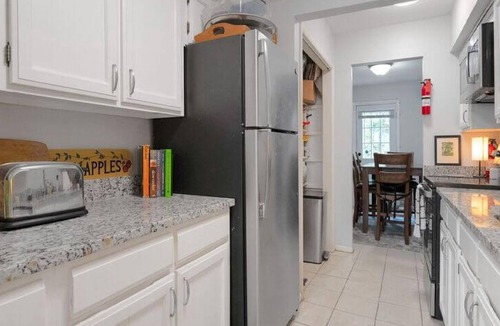 Franconia House | Spacious 4-bedroom townhome in Alexandria with parking and exercise equipment.