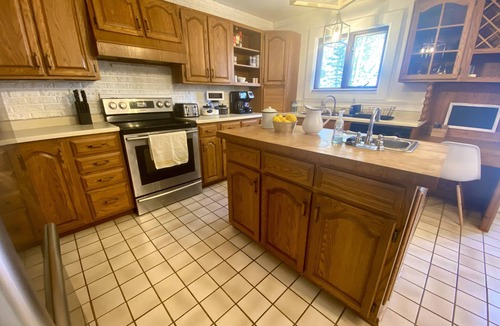 Jocelyn Cottage | Spacious Cottage On Lake with Beach, Fire Pit, Kayaks, Pedal Boat & More!
