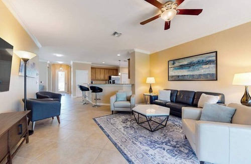 Estero House | Spacious home with enclosed lanai, WiFi, AC, WD, pool, tennis court, & gym