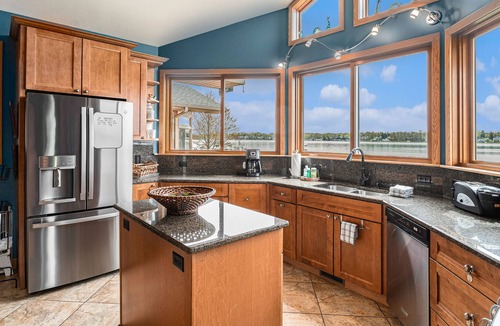 Paw Paw Lake House | Spacious lakefront home with a hot tub, private beach, washer/dryer, & AC