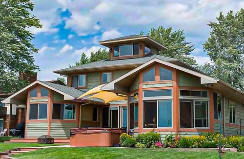 Paw Paw Lake House | Spacious lakefront home with a hot tub, private beach, washer/dryer, & AC