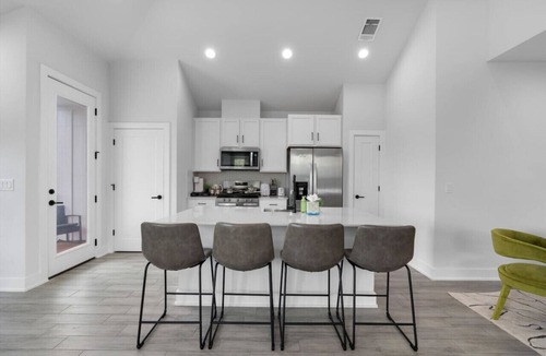 University Hills and Windsor Park Villa | Stylish Downtown Retreat w/Balcony, Reserved Parking + Walkable Access