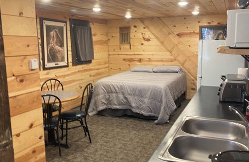 Luverne Cabin | The Little Red Barn - Lakeside Tiny Home Rental -Sleeps 4 - Spiral Staircase