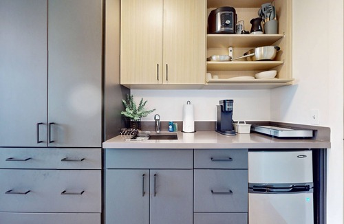 Old Ballard Apartment | Urban studio unit with patio views, shared lounge space and dedicated workspace