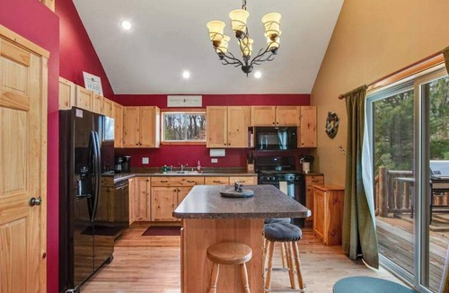 Nekoosa House | Wilderness retreat near the lake with firepit, grill, large deck - dog friendly