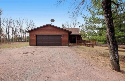 Nekoosa House | Wilderness retreat near the lake with firepit, grill, large deck - dog friendly
