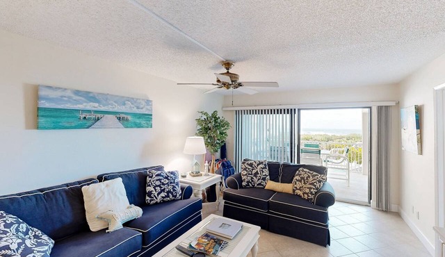 Beachfront condo with ocean views, pool, sundeck, & private balcony