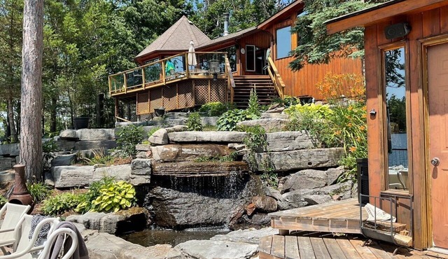 Beautiful south facing lakefront cottage with sauna & hot tub on Big Cedar Lake! in Harcourt