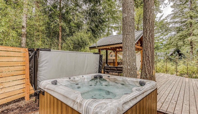 Dog-friendly home with hot tub, shared pool, firepit, fireplace, & river access