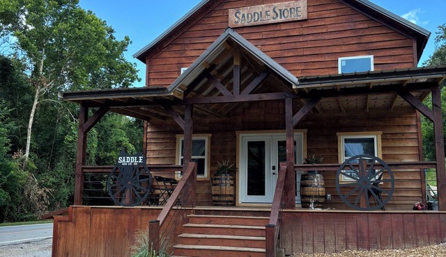 Float the river Historic 1916 Saddle Store with covered porchMammoth Spring Ar