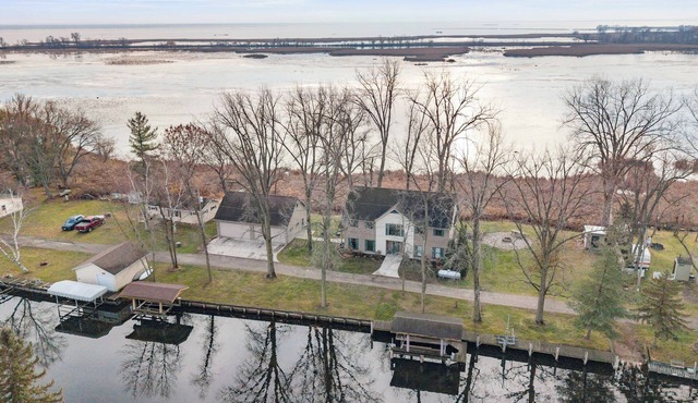 Lake Poygan and canal frontage w/5hp fishing boat and paddle boards included
