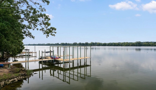 Lakefront Cottage with Boat Slip and Paddleboat