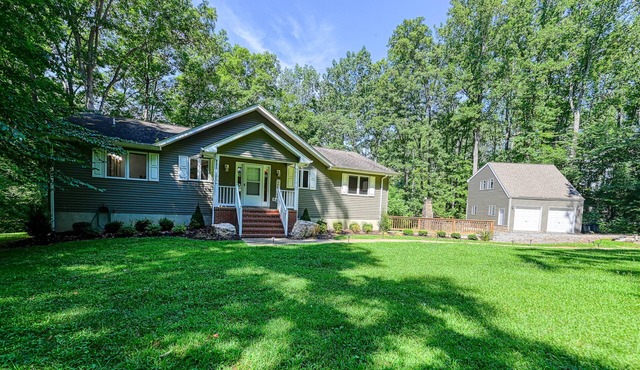 Lakefront home with deck, hot tub, game room, kayaks, & fireplace