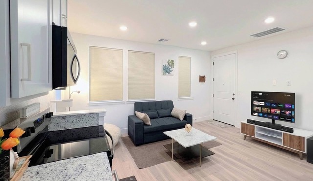Lakeside luxury: Designer park-front suite with Garage