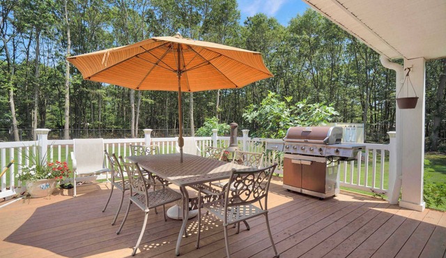 Manorville 4BR Home | Fenced Yard, Deck, Fireplace, Near East End Beaches