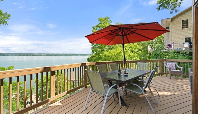 Relax at Poplar Beach Retreat on the sparkling waters of Cayuga Lake. This charming waterfront escape combines rustic character with bright, comfortable living spaces, creating the perfect setting for a relaxing Finger Lakes getaway.