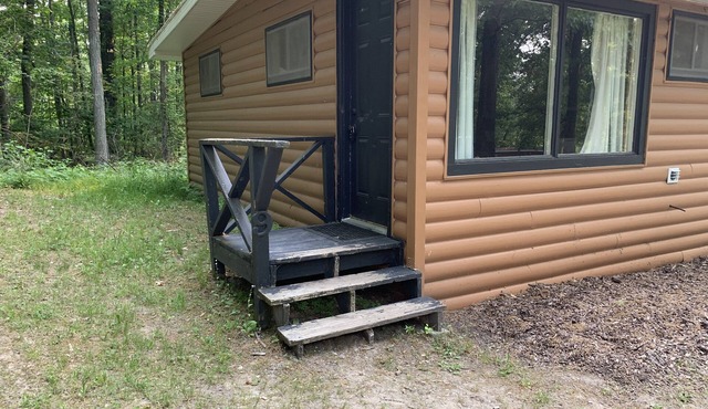 Rustic cabins in secluded campground with lake access and woods to wander in.