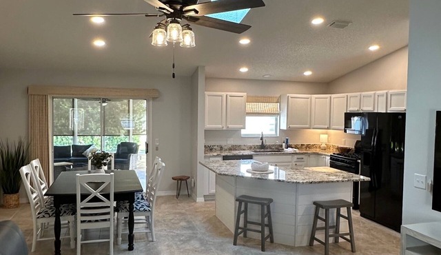 Sunny 3BR Florida retreat with private lanai and open-concept living near golf and dining.
