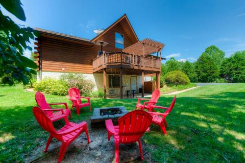 Three-story dog-friendly home with large deck, wood swing, firepit, lawn, & more