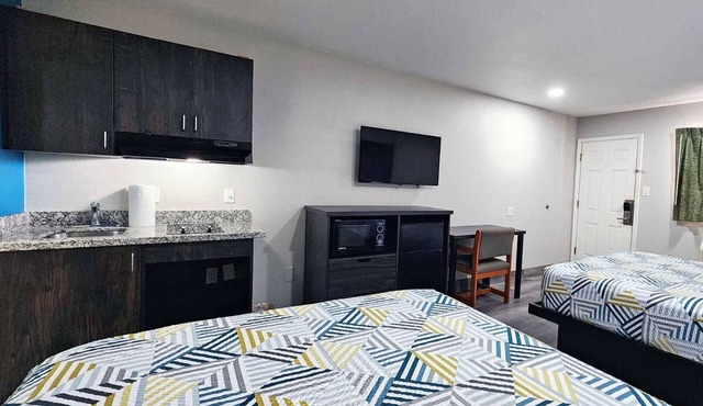 Two Queen Beds Kitchenette Non-Smoking Room at Scottish Inns and Suites! in Wharton