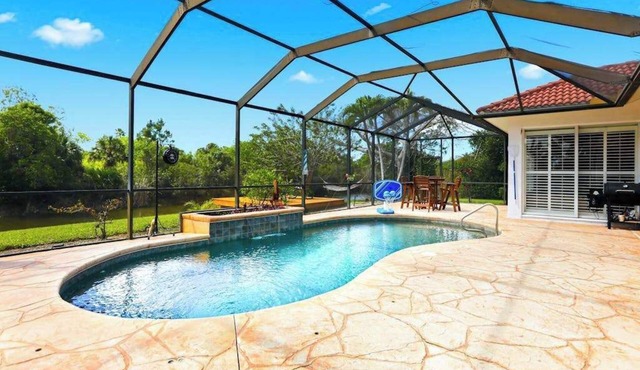 Waterfront home with private heated pool, dock, firepit, grill, bikes, fireplace